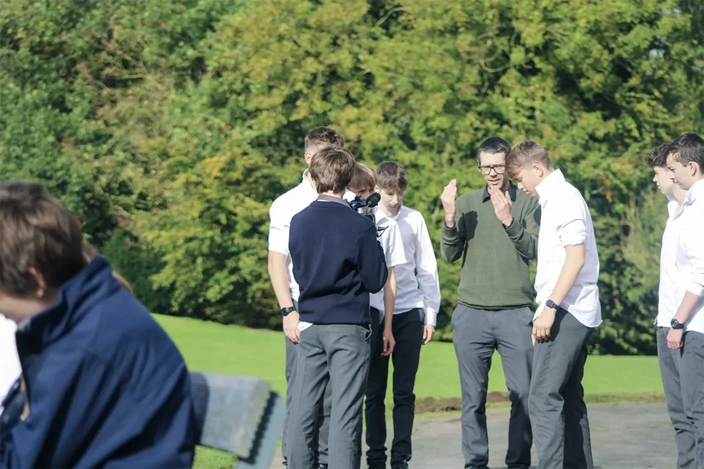 teacher directing students on the acting scene